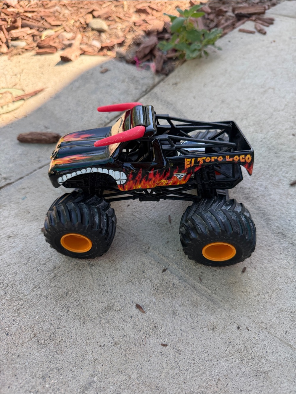 El Toro Loco Monster Truck Toy - Black with Red and Orange Accents